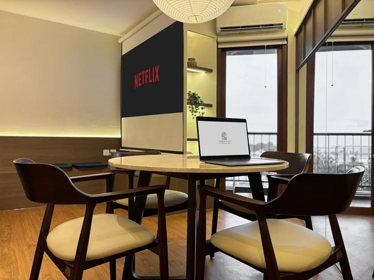 Aoyama: Round dining table for 4 by the small balcony door, handy for a laptop too.