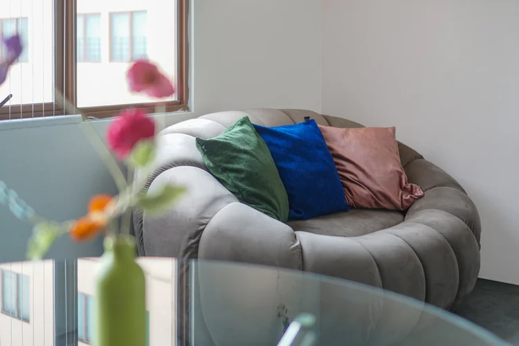 Vancouver: The round sofa with colourful cushions, somewhere to lounge and watch.