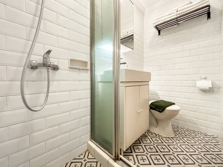 Brooklyn: Modern bathroom with a hot shower; soap and shampoo already stocked, the same in every unit.