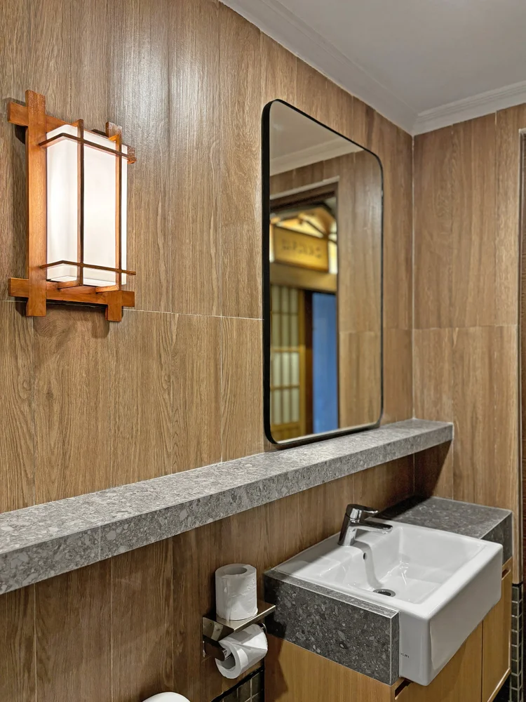 Kawaguchi: Basin and mirror with a shoji lamp, cleaned by our team to CHSE standard before check-in.