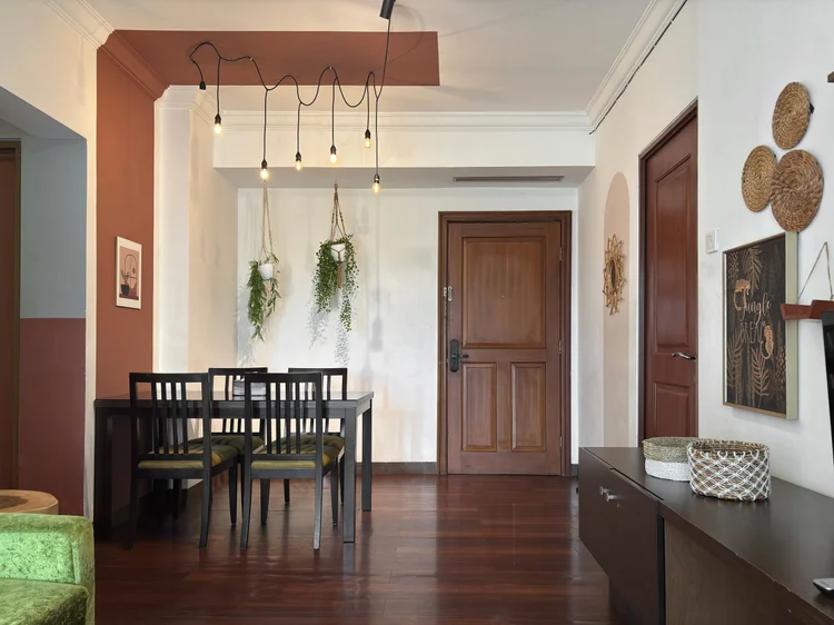 Namibia: Dining table under hanging bulbs, close to the unit's front door.