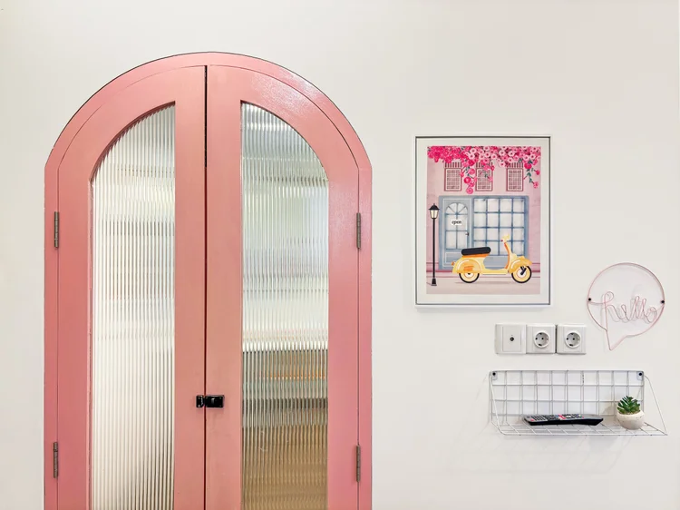 Milan: An arched door in reeded glass, Milan's pastel postmodern signature.