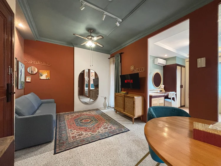 Madagascar: The living room: a sofa bed facing the smart TV, with a ceiling fan.