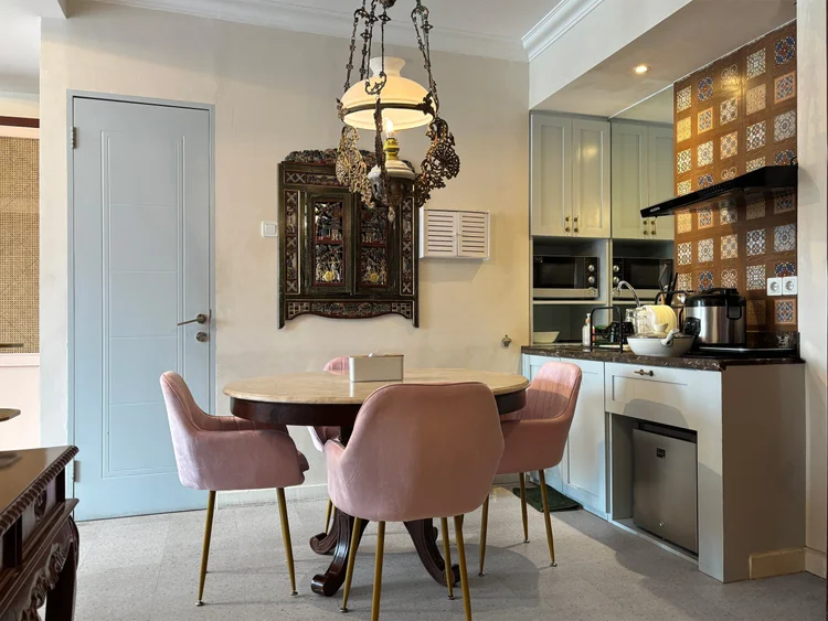 Batavia: The dining table sits right by the open kitchen, so food goes straight to the table.