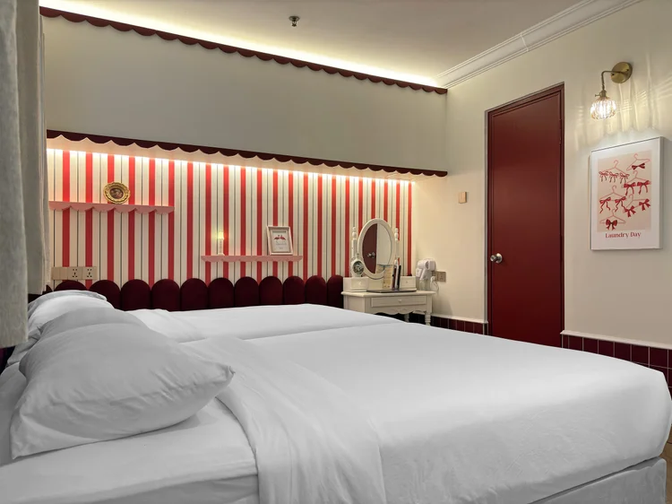 Chamonix: The bedroom has AC, a dressing table, and red-and-white café-style stripes.