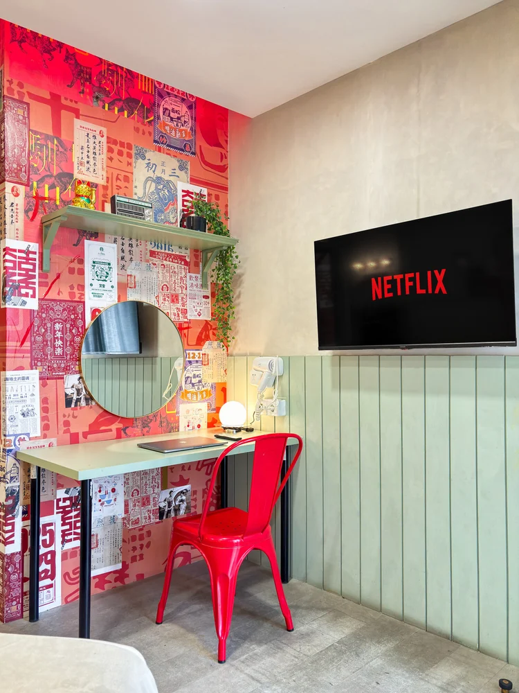 Hong Kong: The dressing table with a red chair, also handy as a desk facing the TV.