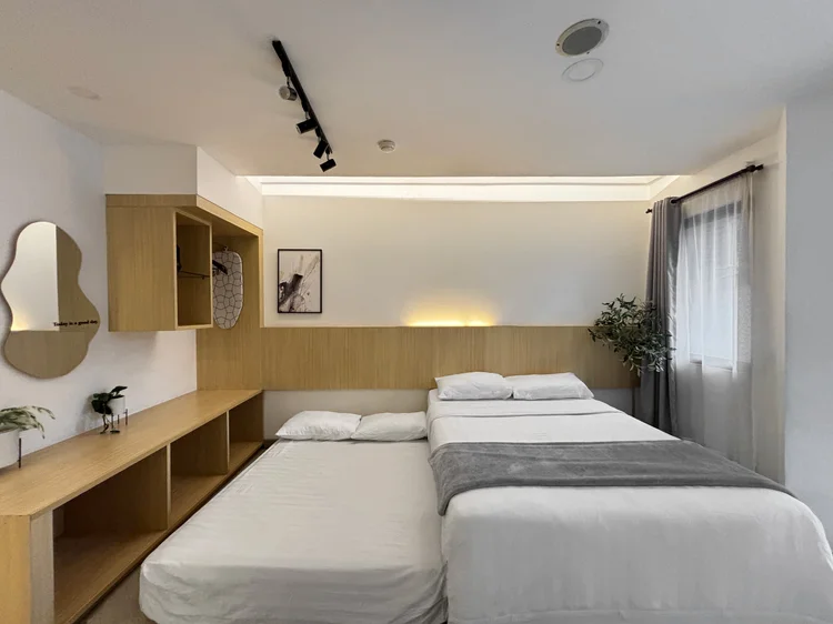Sydney: A sliding bed: the lower half pulls out, making two small double beds.
