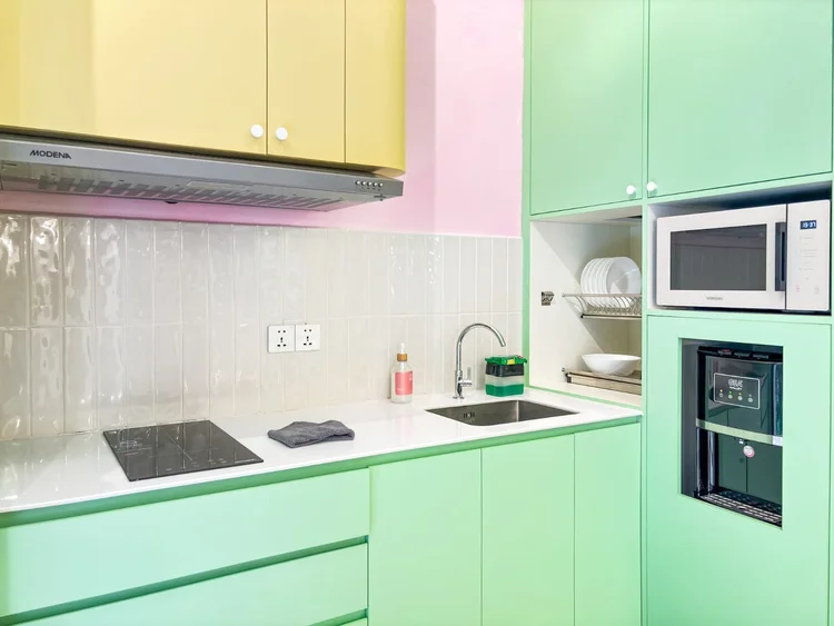 Gangnam: An open kitchen with an induction stove and plenty of storage, ready to cook in.