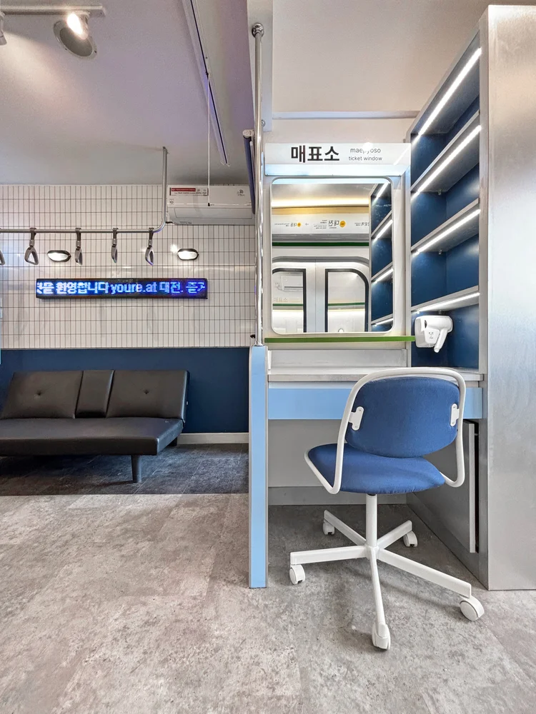 Dae Jeon: A ticket-counter-style work desk, with its own shelf and chair.