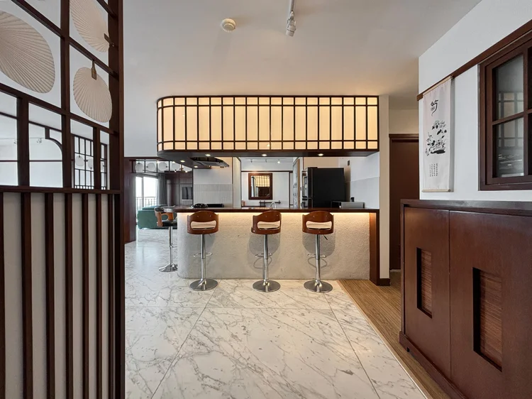 Okinawa: A bar counter with high stools, one of several kitchen spots around this unit.