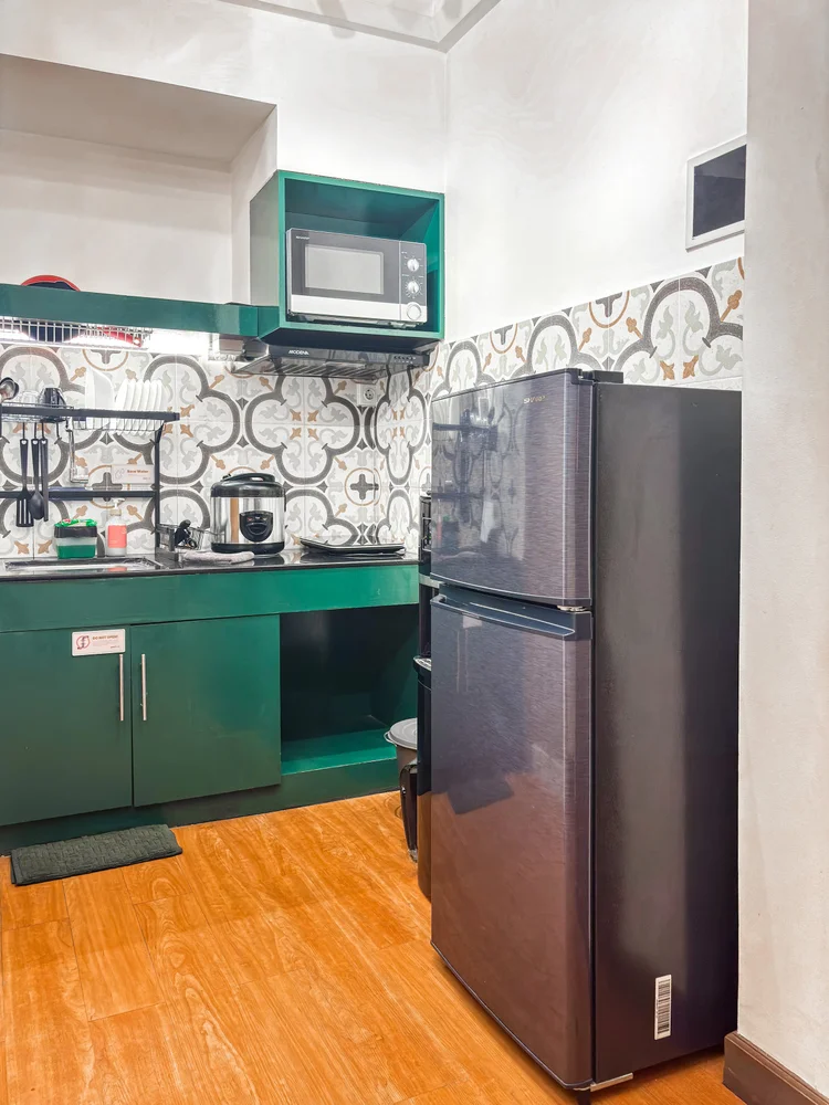 Tanzania: A double-door fridge and microwave in the open kitchen, ready for cooking your own meals.