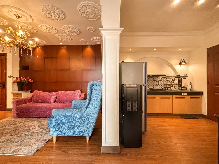 Marseille: Living room and open kitchen flow together, the water dispenser in the corner.