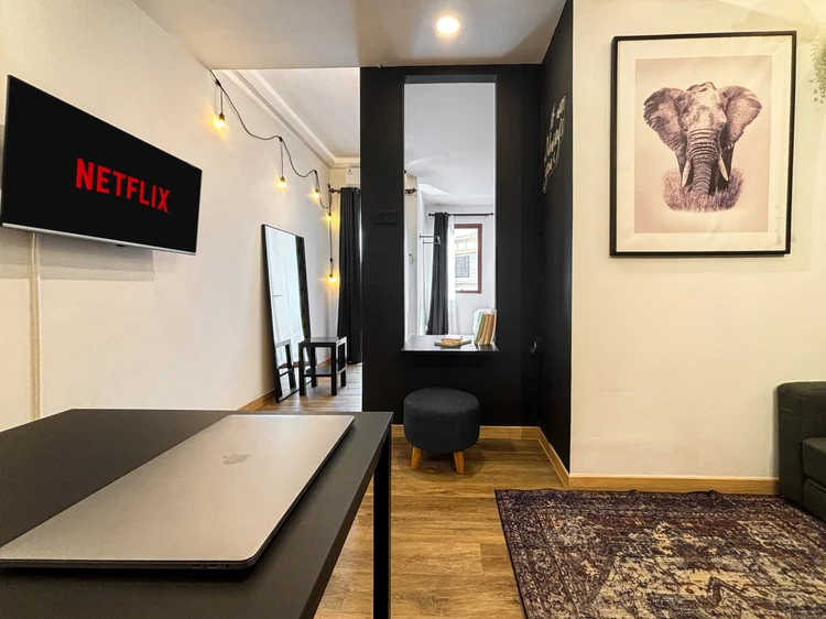 Nairobi: A working desk facing the smart TV with Netflix, the full-length mirror close by.