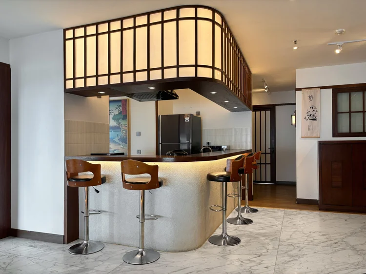 Okinawa: A 55-inch smart TV with Netflix by the bar area, easy viewing over a snack.