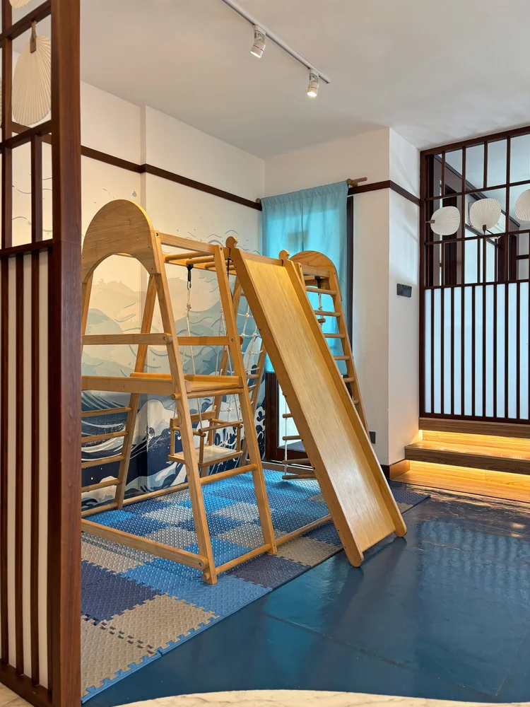 Okinawa: A mini indoor playground with a slide for kids, right inside the unit.