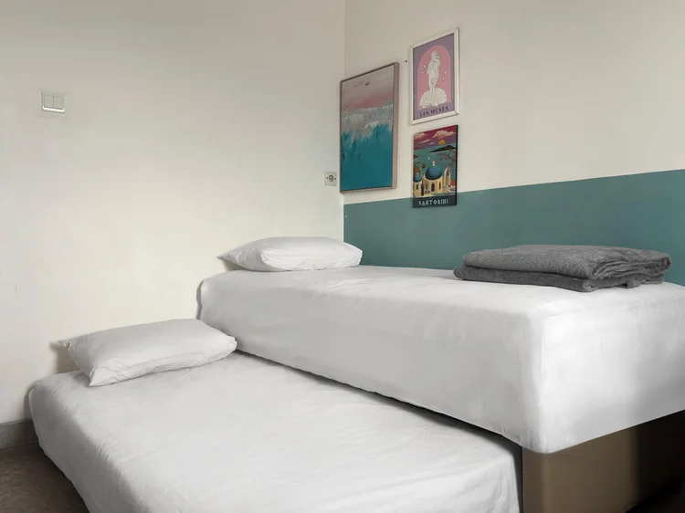 Santorini: The sliding bed in this room pulls out into two separate single beds.