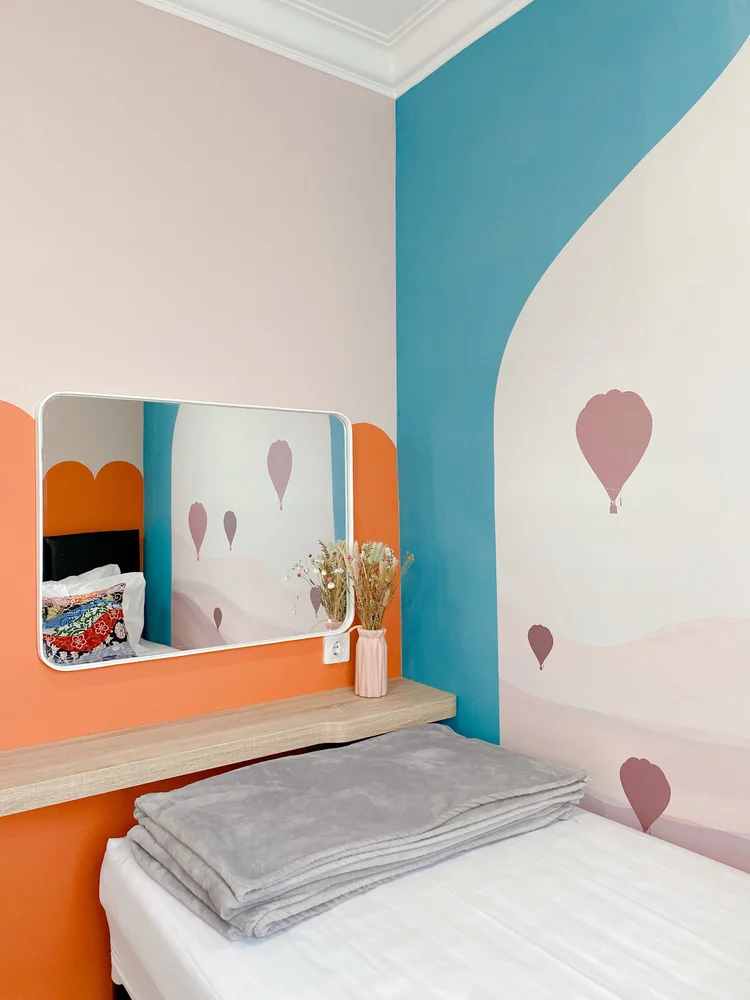 Cappadocia: A bedroom with two single beds that push together, with a mirror and its own AC.