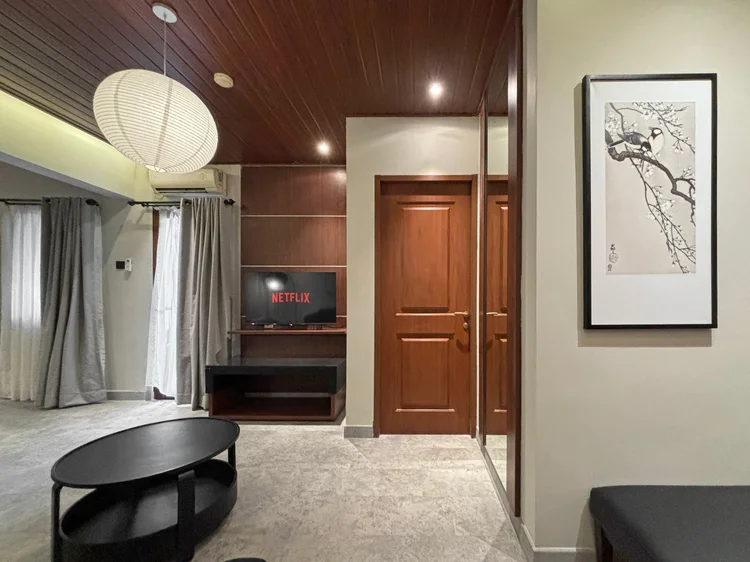 Saitama: The living room leading to the bedrooms, with Japanese-style prints on the wall.