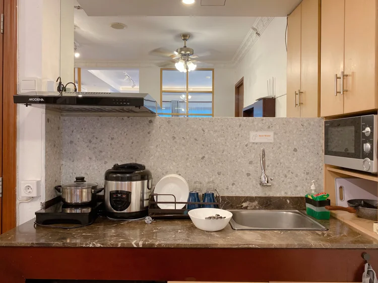 Budapest: Rice cooker, microwave and induction stove; a water dispenser with a spare gallon in every unit.
