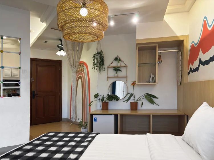 Barbados: Open wardrobe, mirror and a rainbow arch in the bed area.