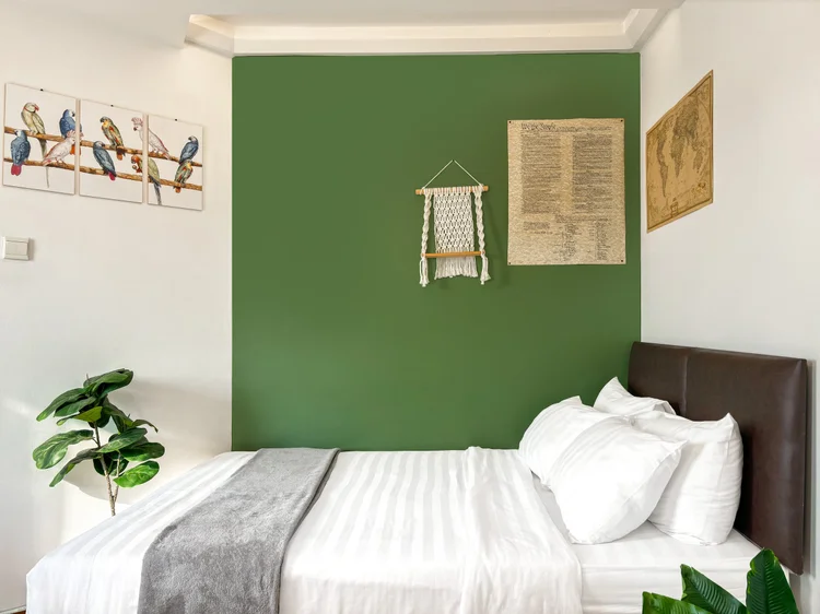 Tanzania: Master bedroom with a green accent wall. Sleeps 6, up to 8 with extra beds.