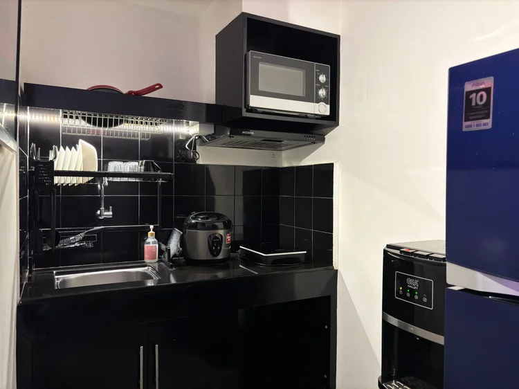 Copenhagen: Open kitchen with an induction stove and mini fridge; the lobby convenience store sells the basics for cooking.