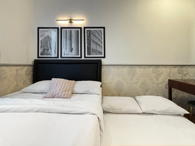 Paris: The sliding bed pulled out: two beds side by side in one room.
