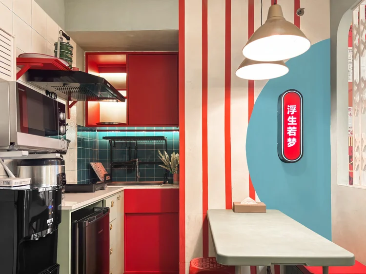 Hong Kong: Open kitchen with microwave and water dispenser; every unit keeps a spare gallon.