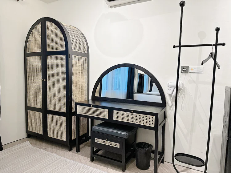 Los Angeles: A wardrobe, dressing table and clothes rack, all in one corner of the bedroom.