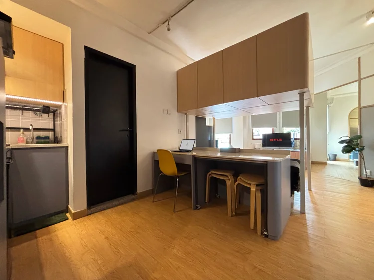 Den Haag: The space under the loft bed holds the kitchen and a work desk.