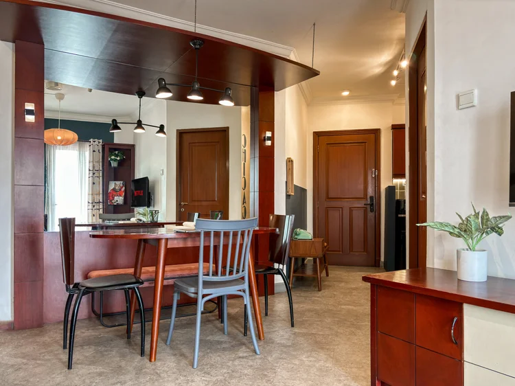 Chicago: Dining table with mismatched wooden chairs, good for meals together or working from the table.