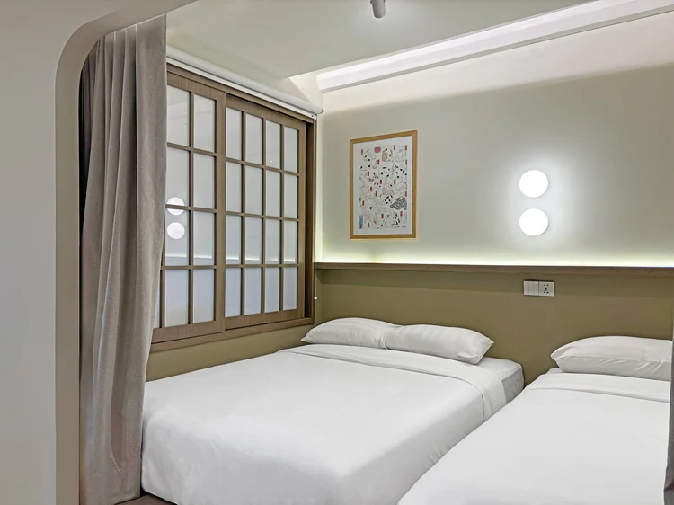 Aoyama: The platform bed nook with curtains, set apart by sliding shoji screens.