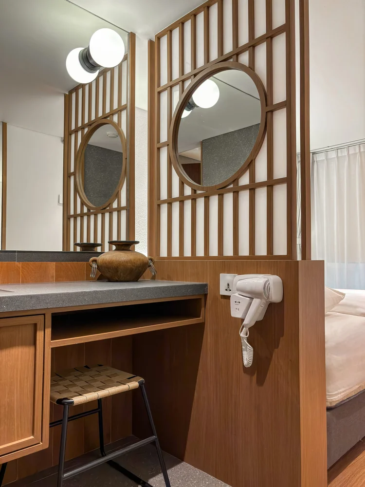 Shizuoka: A dressing table with round mirrors and a hair dryer, every bedroom has its own.