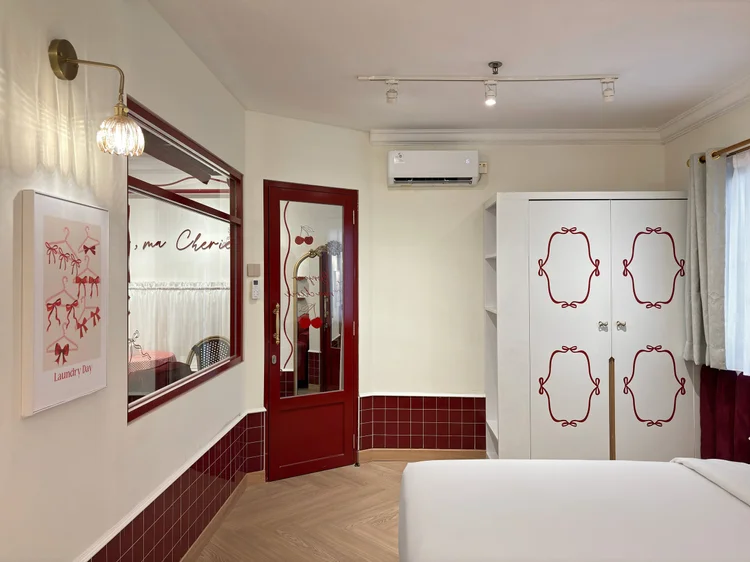 Chamonix: Wardrobe with a cherry motif and a large mirror, plus AC in the bedroom.