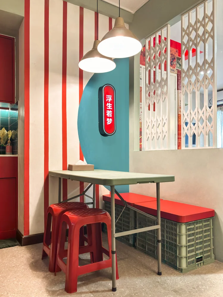 Hong Kong: A four-person dining table with red plastic stools, Hong Kong eatery style.