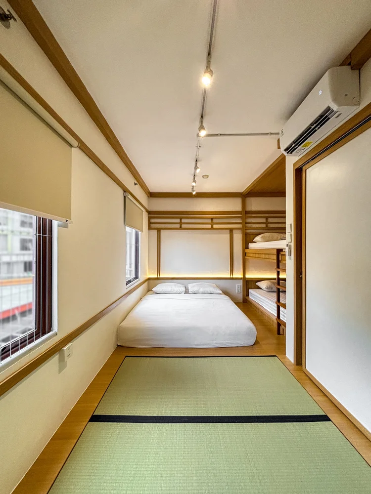 Omotesando: The bedroom with its own AC and window, the bunk bed at the far end.