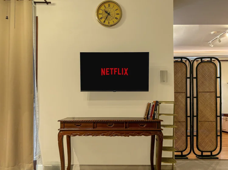 Batavia: Smart TV with Netflix, and a rattan screen to close off the bed area.