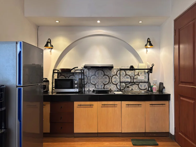 Marseille: Induction hob, microwave and basic cooking tools are in the kitchen.