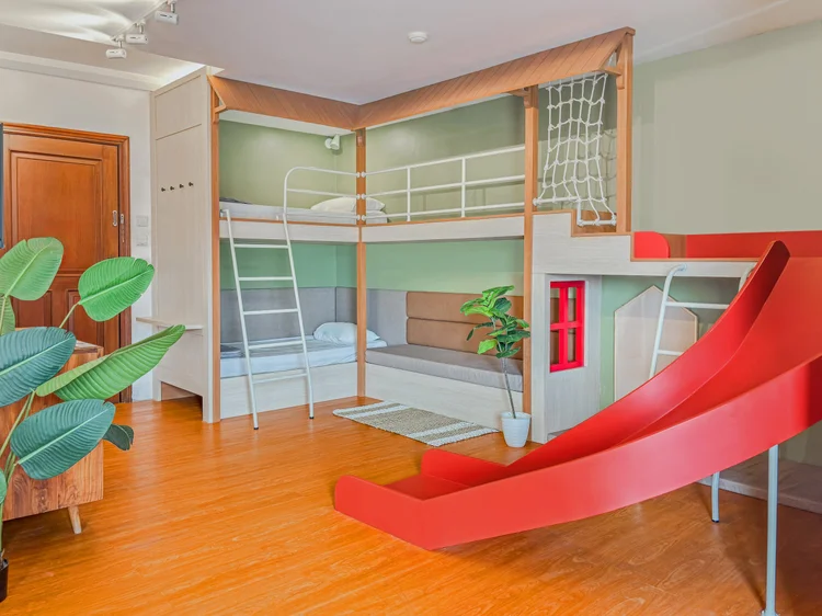 Tanzania: A 90 cm bunk bed in the living room, with a slide down from the loft.