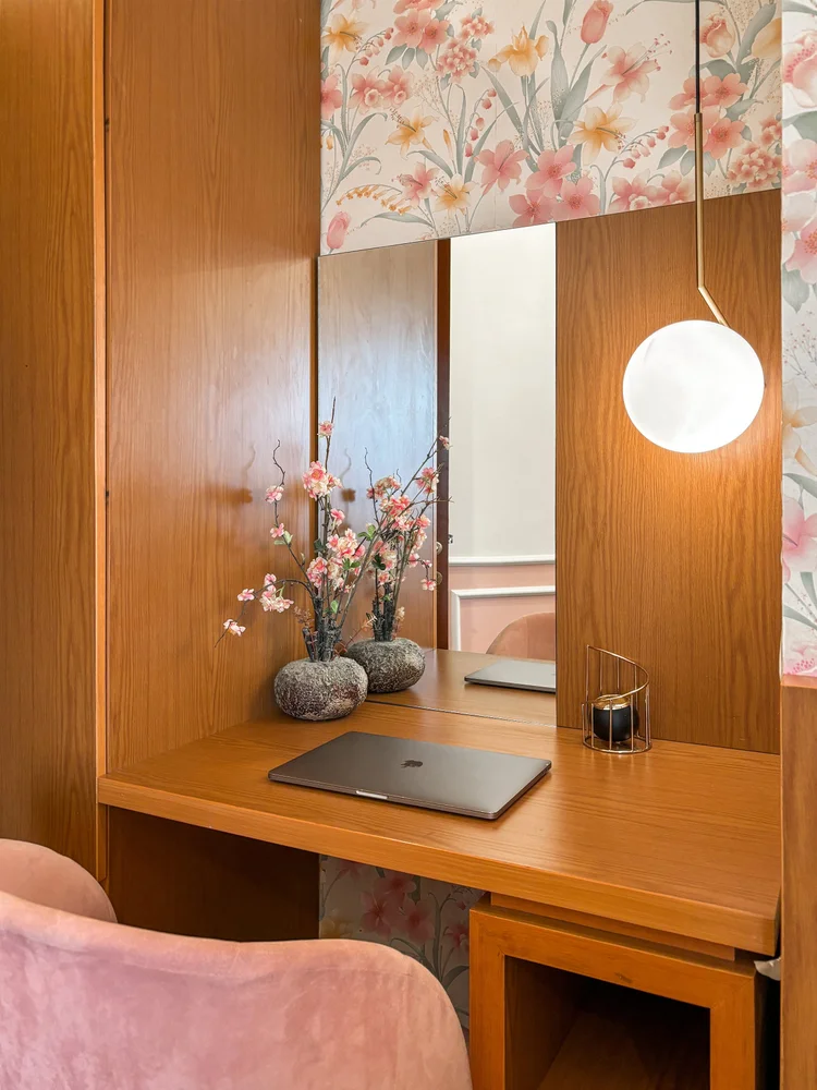 Salzburg: A dressing table that doubles as a desk, with a chair and a round pendant lamp.