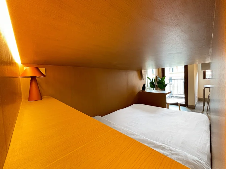 Helsinki: The upper loft bed with its own reading lamp and window.