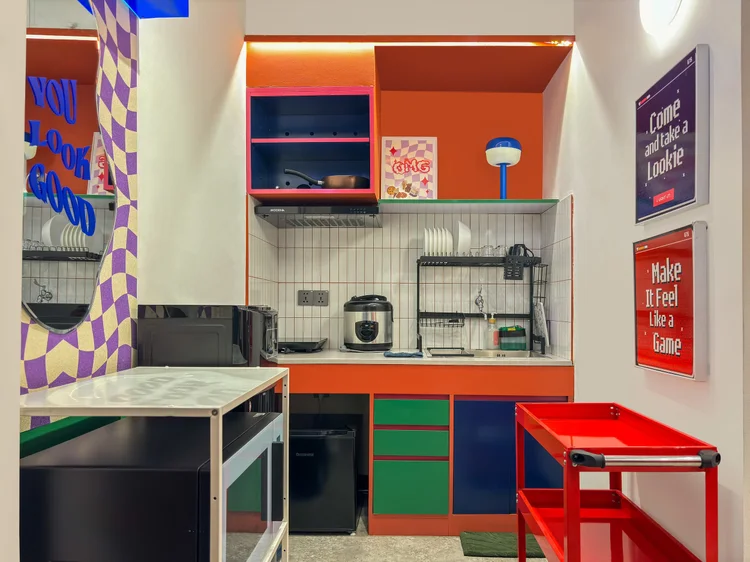 Hong Dae: Open kitchen with microwave, rice cooker and fridge.