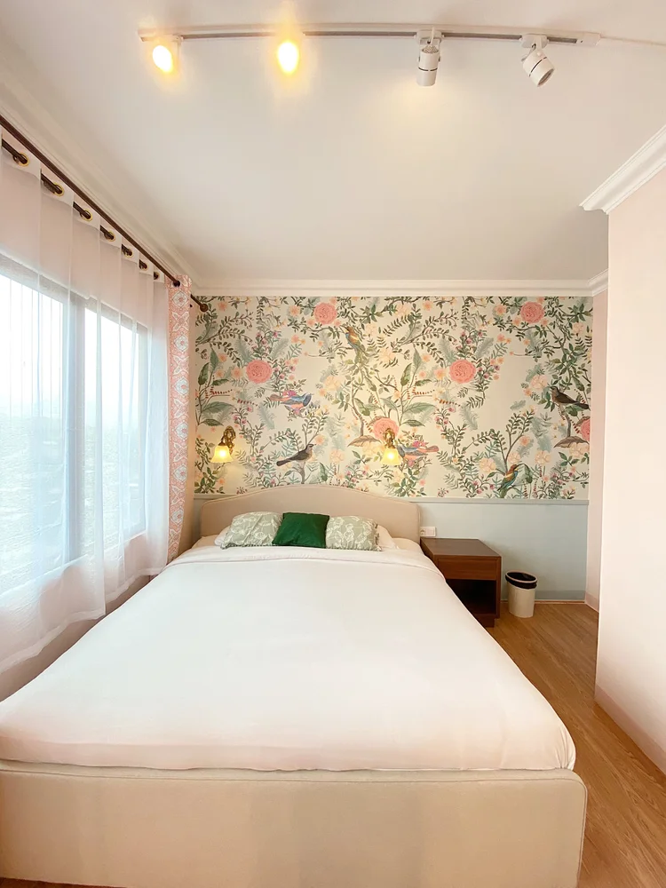 Malacca: A curtained window at the foot of the bed, AC in every room.