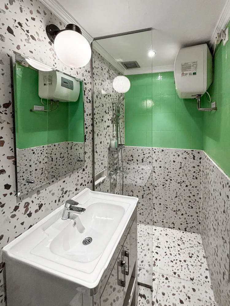 Tanzania: Basin and a hot-water shower; the same soap and shampoo in every unit.