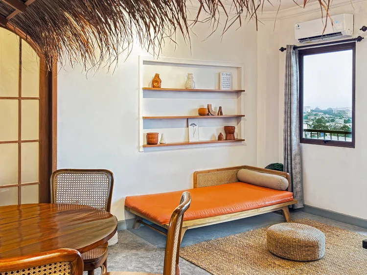 Ubud: The day bed in the living room, with AC and a window facing the city and mountain view.