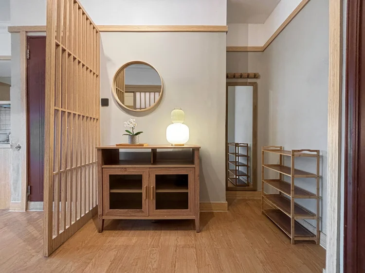 Fukuoka: A full-length mirror by the entrance, with a shoe rack beside it.