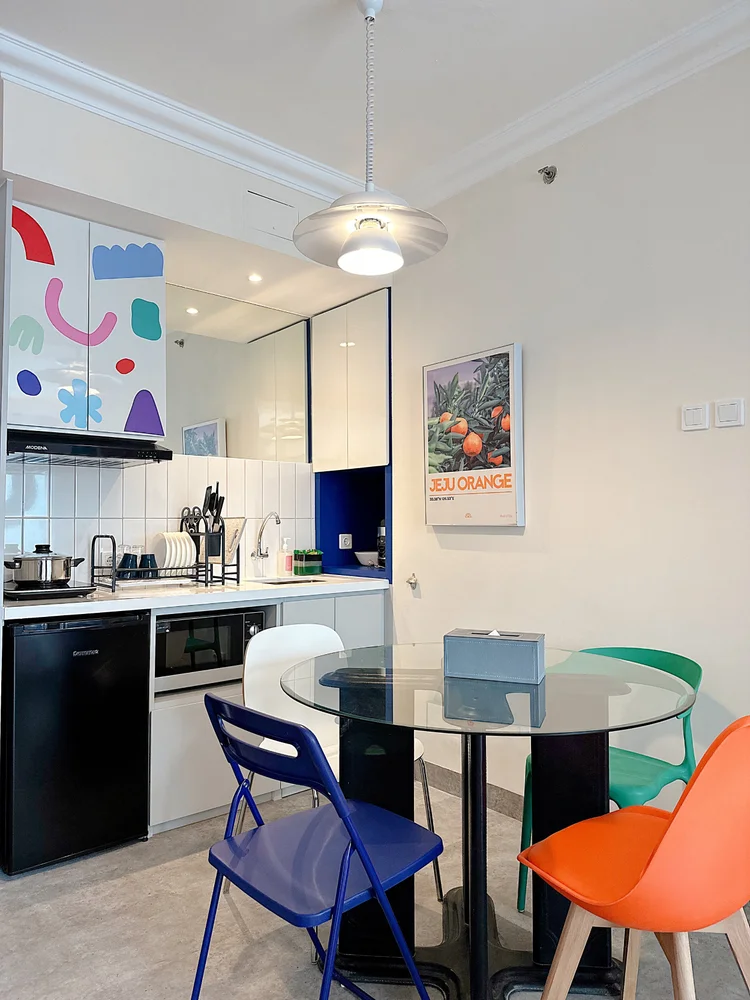Jeju: A mini kitchen with a stove and its own dining table, enough to cook and eat in.
