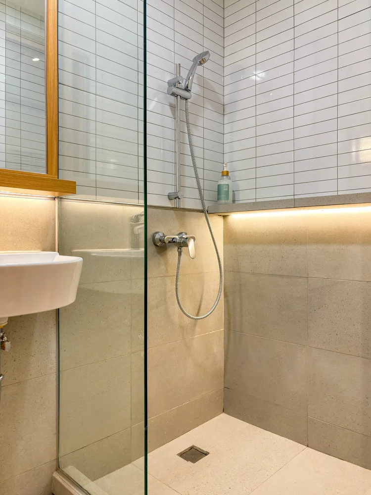 Omotesando: A shower with a water heater, for a warm shower any time.