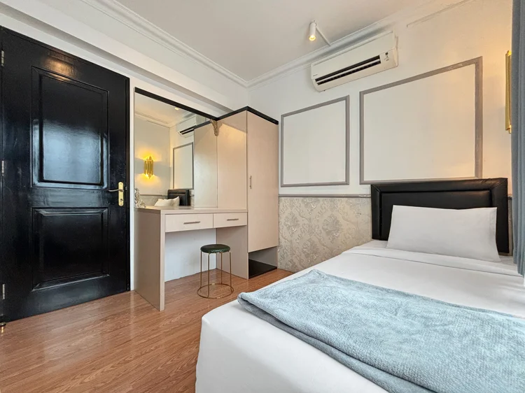 Paris: Another bedroom with a sliding bed, dressing table and its own AC.