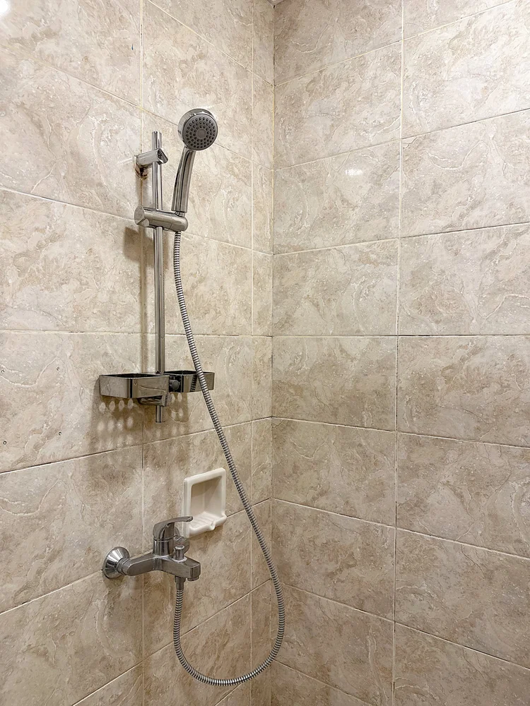 Amalfi: A shower with a water heater, for a warm shower any time.